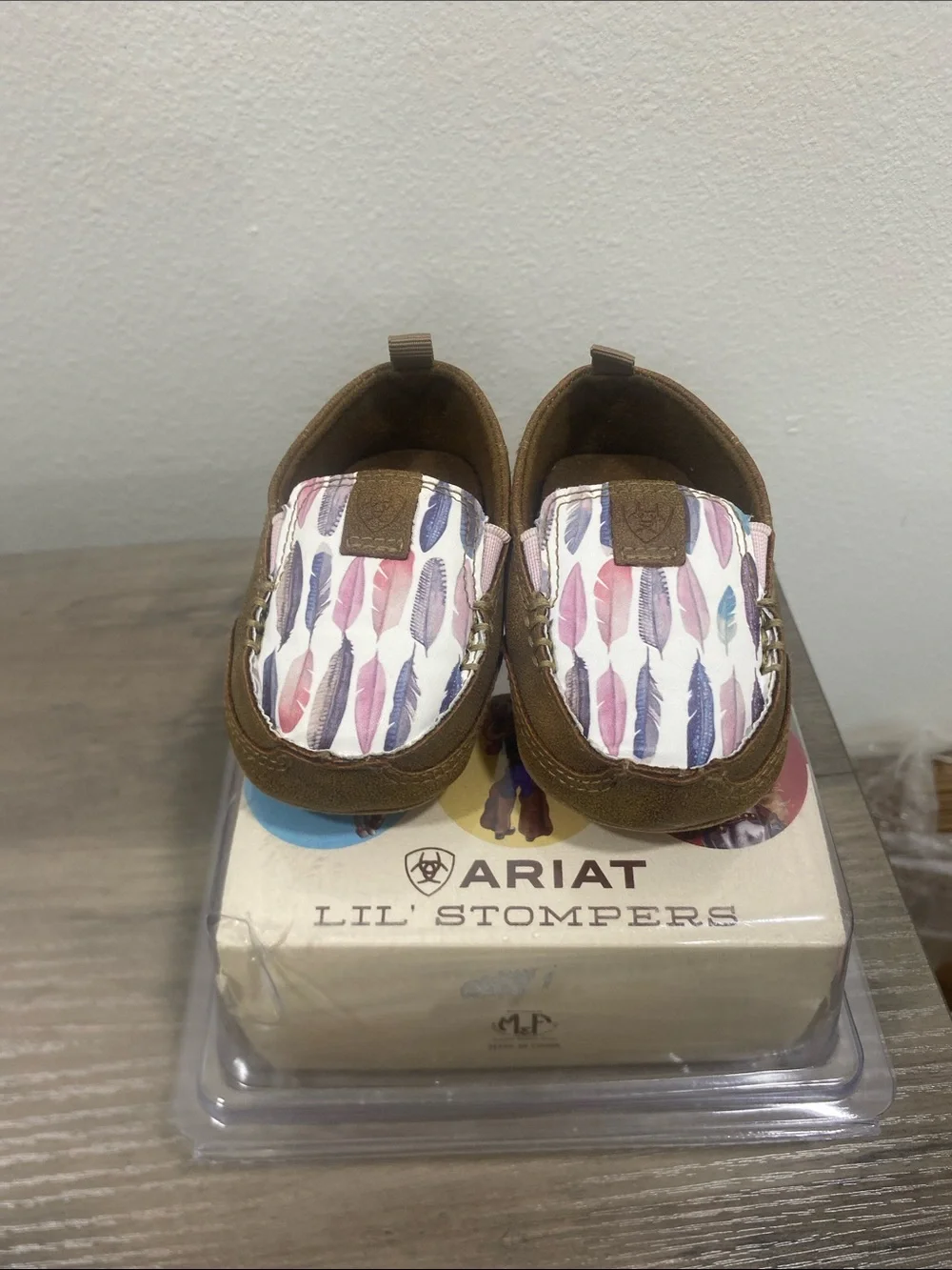 Ariat Kids Brown Moccasins with Pink Purple and Blue Feather Print